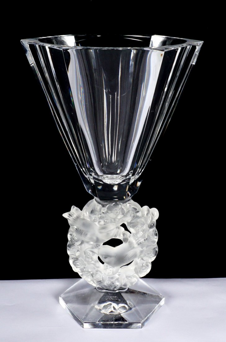 Lalique Mesanges Crystal Vase: Six sided clear top over frosted floral wreath with birds, clear foot, signed Lalique France. 12.25" h. x 6.5". Condition: Chip to edge at top of upper section.