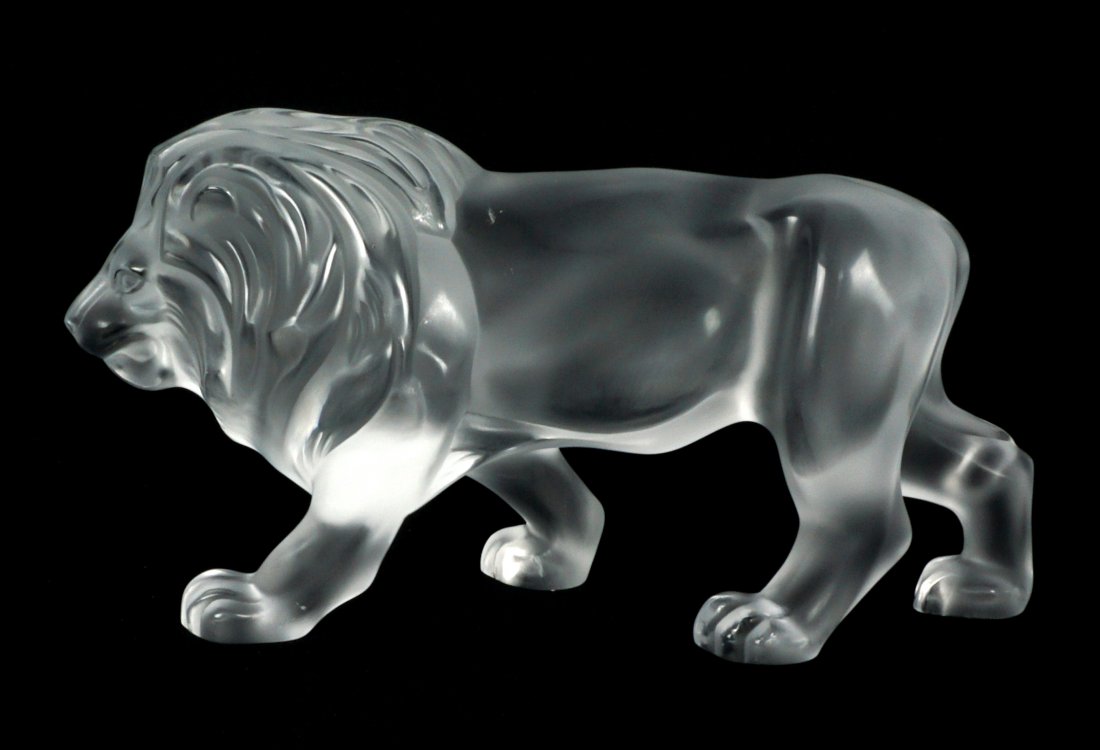 Lalique Frosted Crystal Lion: Figure of a crouching lion, signed Lalique France, 5.5" h. x 11.5" x 3.5". Chips to mane.