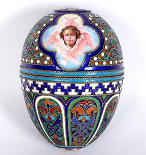 Ovchinnikov Marked Russian Silver Enameled Egg: Finely detailed stylized floral and geometric motifs with winged angel in reserves, vermeil interior, bearing obscured hallmarks for Pavel Ovchinnikov, illegible assay mark, town mark with 91. 3.5" x