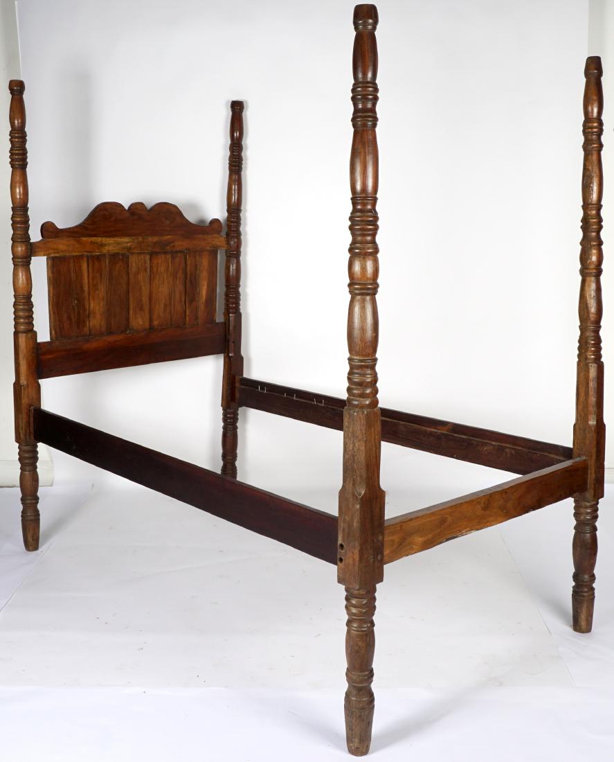 Caribbean Four Poster Bed: Caribbean style, exotic hardwood bed, headboard with shaped crest. Overall 78" h. x 49.5", sold with the 77.75" overall rails. Condition: Scratches, dings, wear consistent with age and