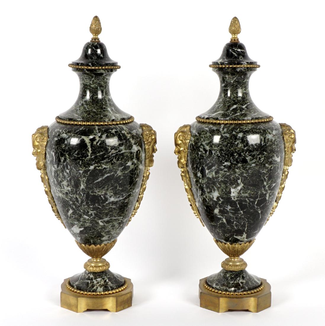 Pair Gilt Bronze Mounted Marble Cassolettes: Baluster urn form cassolettes, variegated marble, pineapple finials, beaded bands, satyr masqueron and foliate mounts, bronze bases. Overall 16.5" x 7".