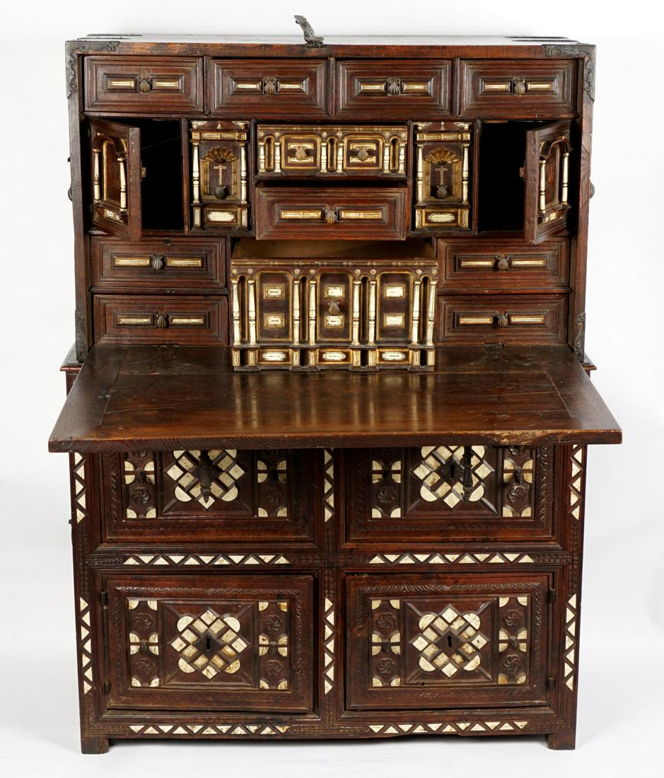 18th Century Bone Inlaid Spanish Vargueno Desk: Fall front top writing surface rests on two pull out supports with shell knobs. Fitted interior with multiple drawer and doors, carved and inlaid bone architectural elements and accents. Two drawer ov