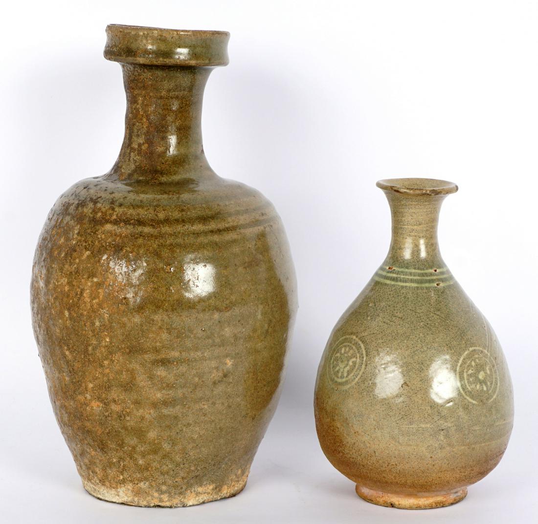 Two Antique Korean Celadon Vases: Teo pieces total to include 1) Tapered ovoid form with raised lip, overall 10" h. x 5.75". Chip to lip. 2) Squat ovoid form, shoulder with two bands, floral medallions on body, 6.75" h. Condition: Bot