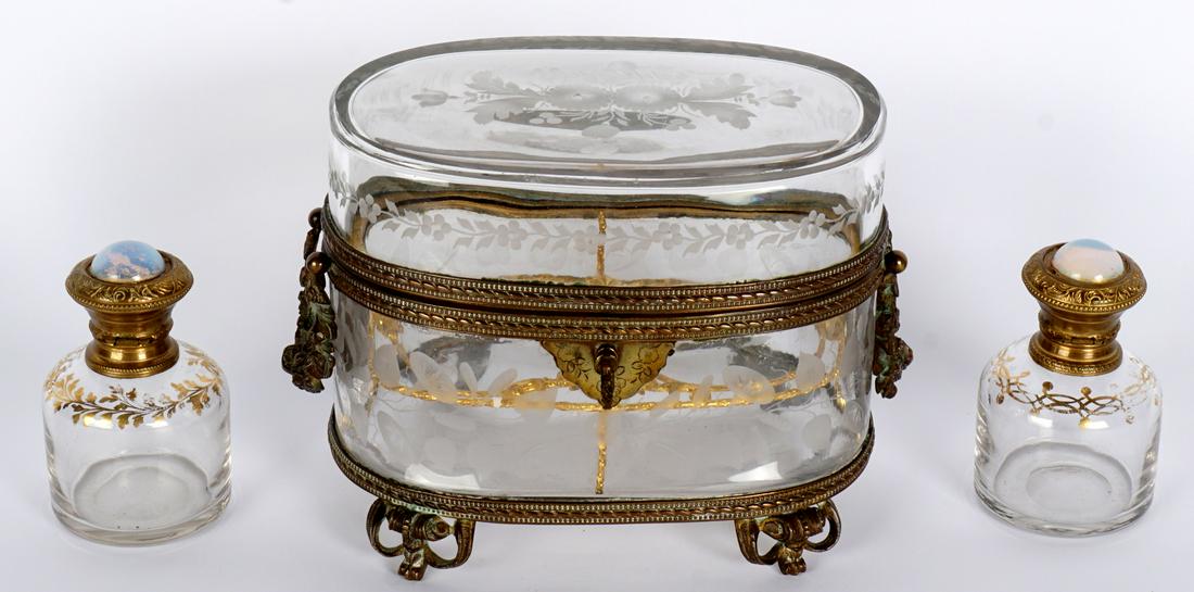 Baccarat Style Bronze Mounted Perfume Box: Etched glass body, bronze and brass mounts, holds two gilt decorated perfume bottle, hinged lids with opalescent glass cabochons, frosted glass stoppers. on 4 scroll feet. Key lock works, 5" h. x 6.75