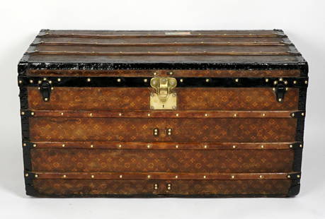 Vintage Louis Vuitton Monogrammed Steamer Trunk: Monogrammed logo exterior, wood straps, original brass tacks, blackened metal corners, stamped brass latch. Striped interior with Louis Vuitton Paris and London label. Monogrammed H. H. M. Cincinnati