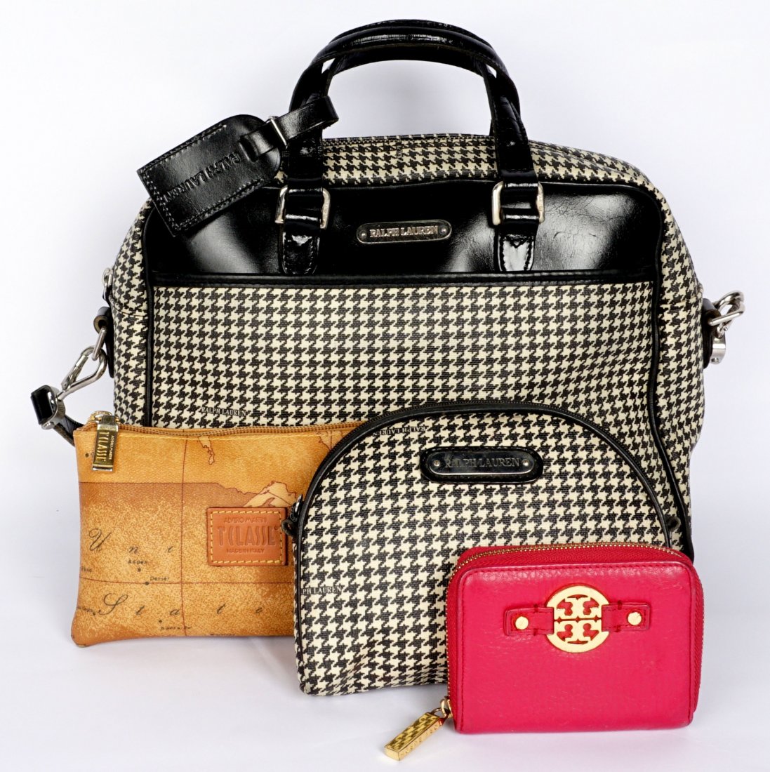 Four Ralph Lauren, Tilasse, & Tory Burch Purses: An assembled collection of four pieces to include 1) Ralph Lauren houndstooth shoulder bag, 10" h. x 12" x 5.5". 2) Matching Ralph Lauren makeup bag. 3) Alviro Martini Tilasse Geo clutch. 4) Tory Burc