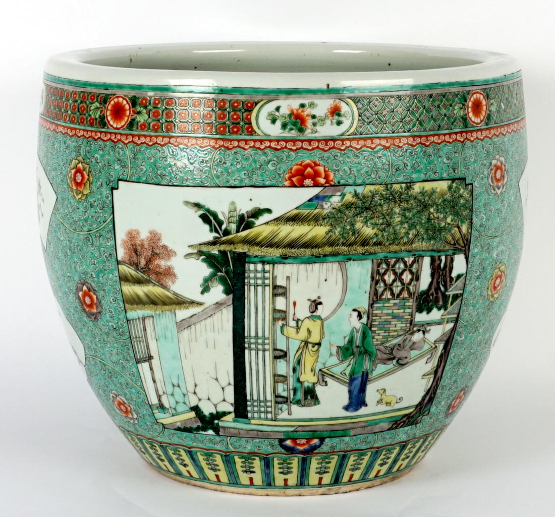 Chinese Qing Famille Verte Porcelain Fish Bowl: 19th Century, foliate scroll famille verte ground, reserves with indoor and outdoor genre scenes, household items, and floral medallions. Unmarked, 13.75" h. x 16". Condition: No chips, cracks, or rep