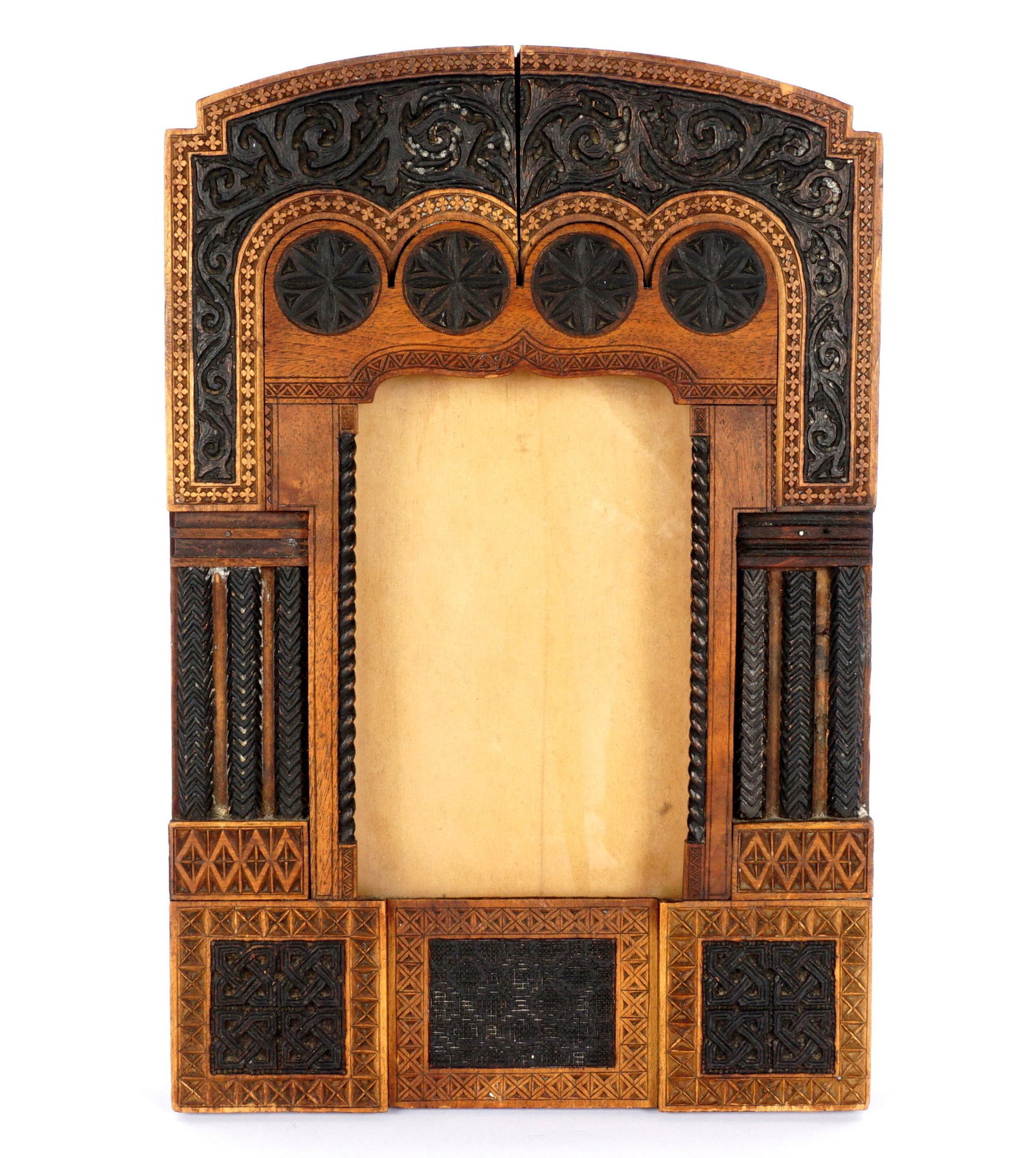 Attributed Carlo Bugatti Italian Carved Frame: Attributed to BUGATTI, Carlo, (Italian, 1856-1940): Carved mixed wood frame with foliate scroll crest of 4 stylized floral medallions, bordered in quatrefoil band. Side with three half columns, lower