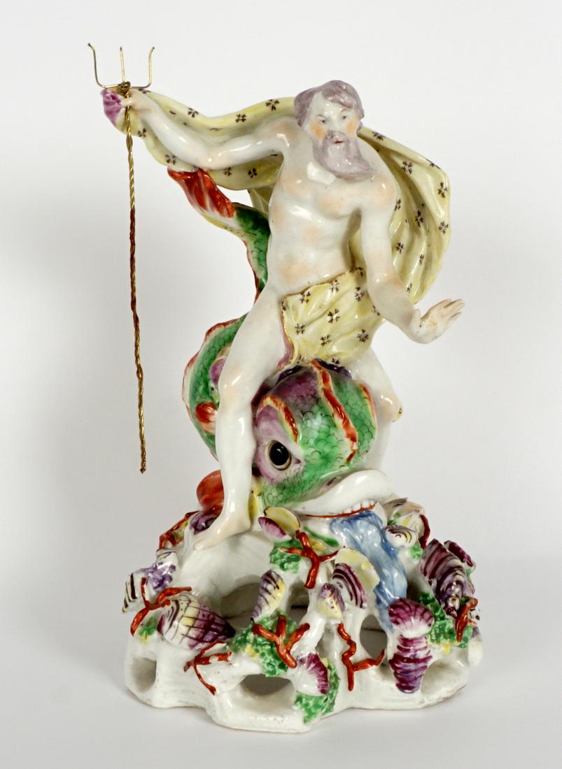 Exhibited Bow Figural Porcelain Neptune & Dolphin: Bow figure Emblematic of Water with figure of Neptune riding a dolphin, reticulated sea floor base. Base with exhibition sticker for "The Art of Dining, 1998-1999, Gardiner Museum, Toronto"; Christie'