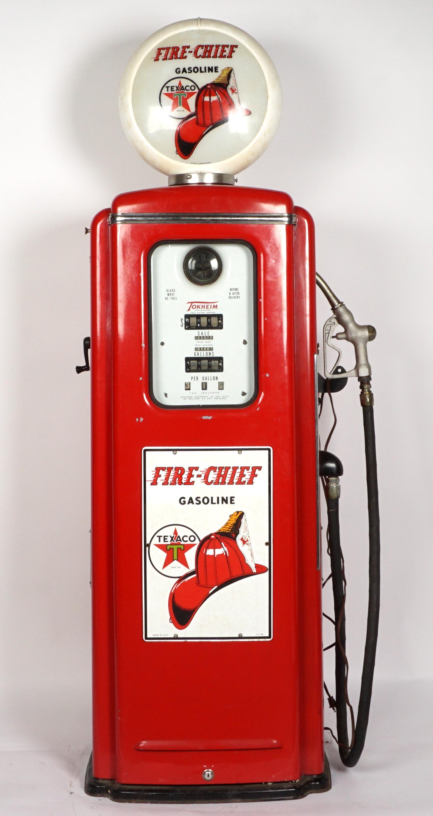 Texaco Fire Chief Tokheim 39A Gas Pump: Restored with Texaco Fire Chief red enamel body, badges and globe, Tokheim plaque serial number B 87115, overall 74" h. x 29.5" x 16.5". Condition: Chips to enamel, dials not functioning.