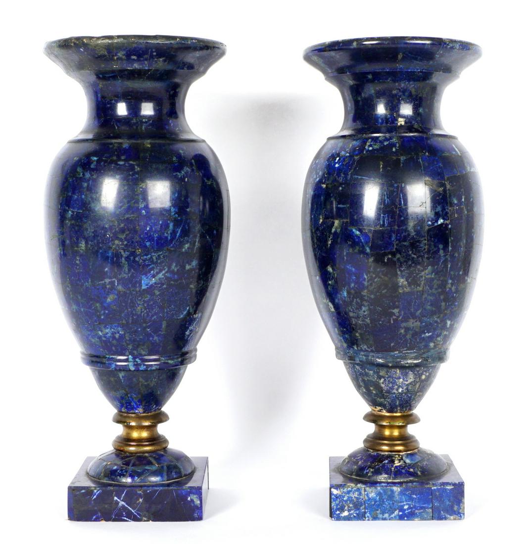 19th C Pair Lapis Lazuli Clad Garniture Urns: 19th Century Baluster form garniture set clad in lapis lazuli panels, ormolu mount at base, overall 14.5" h. x 6". Condition: One with repairs to rim.