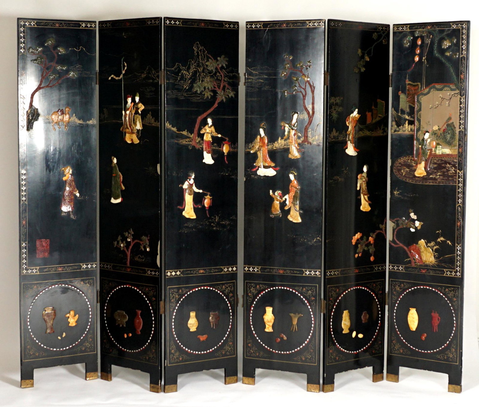 Six Panel Chinese Hardstone and Lacquer Screen: Six panel coromandel screen, black lacquer with applied jade, bone, and other hardstone figures, camel, trees, and other precious objects, signed with six character red seal. Back side with gilt and p