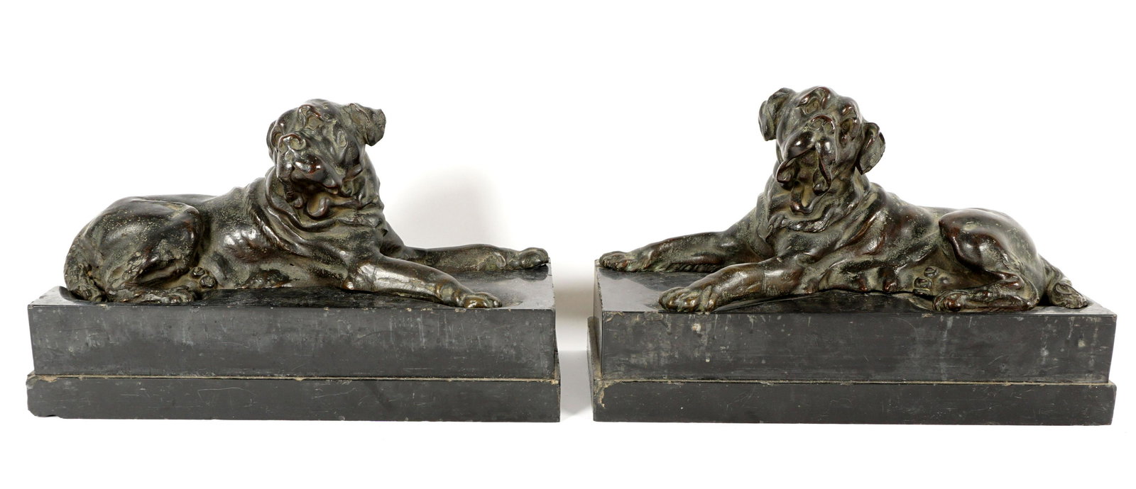 Pair of Bronze Mastiff Dogs on Marble Bases: Mirror image pair of cast bronze mastiffs, resting on black marble bases, no visible signatures. Ex property of the American Kennel Club Museum of the Dog, overall on base, 8.25" h. x 14" x 16.75". Co