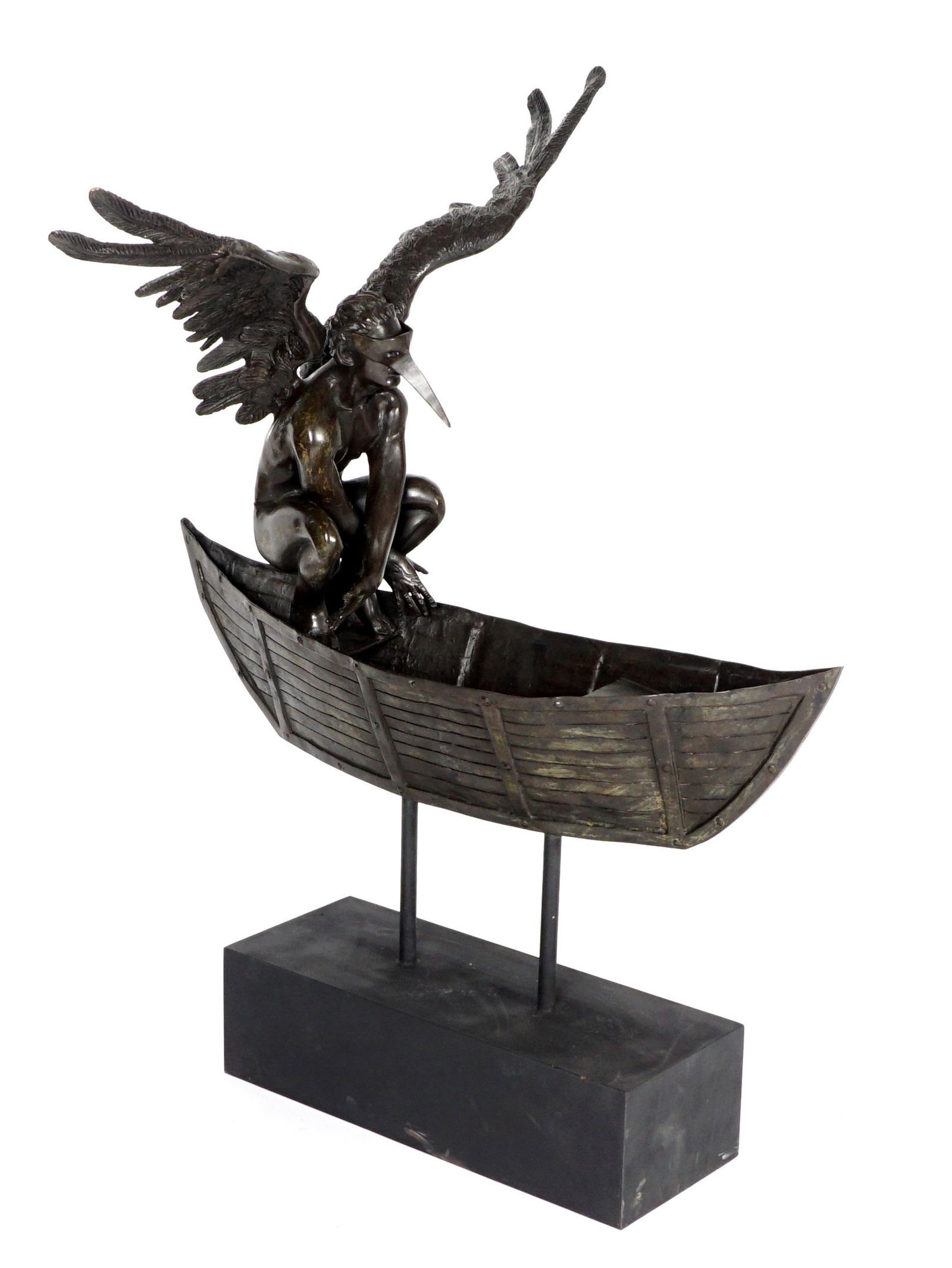 Large By/After Jorge Marin Angel in Boat Bronze: by/after MARIN, Jorge, (Mexican, 1963-): Bronze figure of a masked winged angel in a boat, signed on seat, overall on wood plinth measures 52.5" h. x 40" x 45".