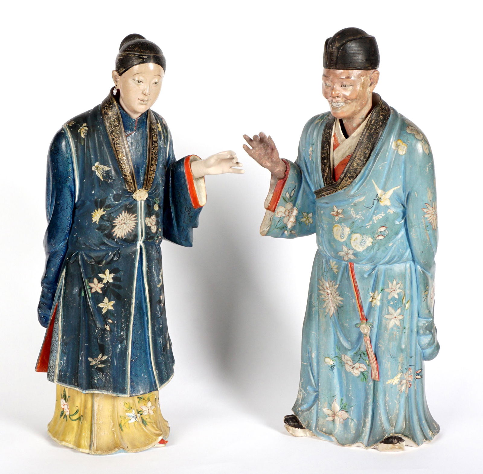 Pair 19th C Chinese Nodding Head Figures: Mid 19th Century, polychrome paint decorated clay figure of a man and woman, each with nodding heads, one arm in raised position, woman with earrings, man bears an older label inside "From the Collect