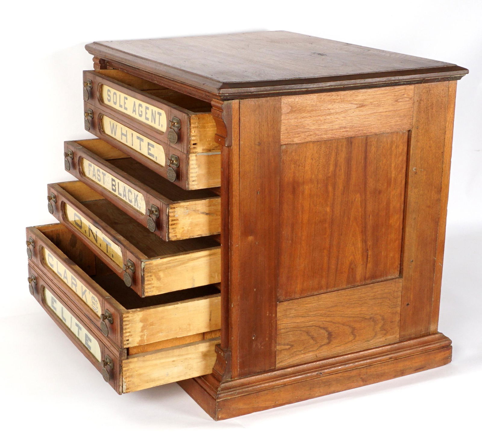 Clark's ONT Six Drawer Walnut Spool Cabinet: Walnut case, six drawers with painted glass inserts, O.N.T. pulls, overall 22.5" h. x 10" x 7". Condition: One cracked insert, craquelure and minor loss to paint.