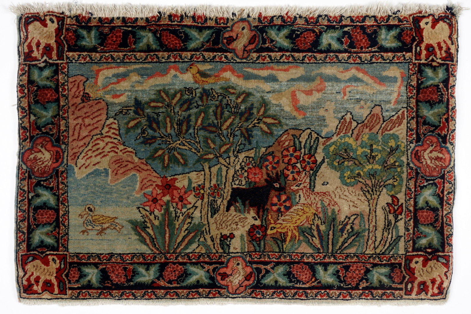 Semi Antique Pictorial Tabriz Rug 1' 11" x 2' 11": Hand woven wool Tabriz rug, center landscape with trees, animals, and birds. Grape vine motif border, camels in corners, 1' 11" x 2' 11". Condition: Fraying at top, could us a proper cleaning.