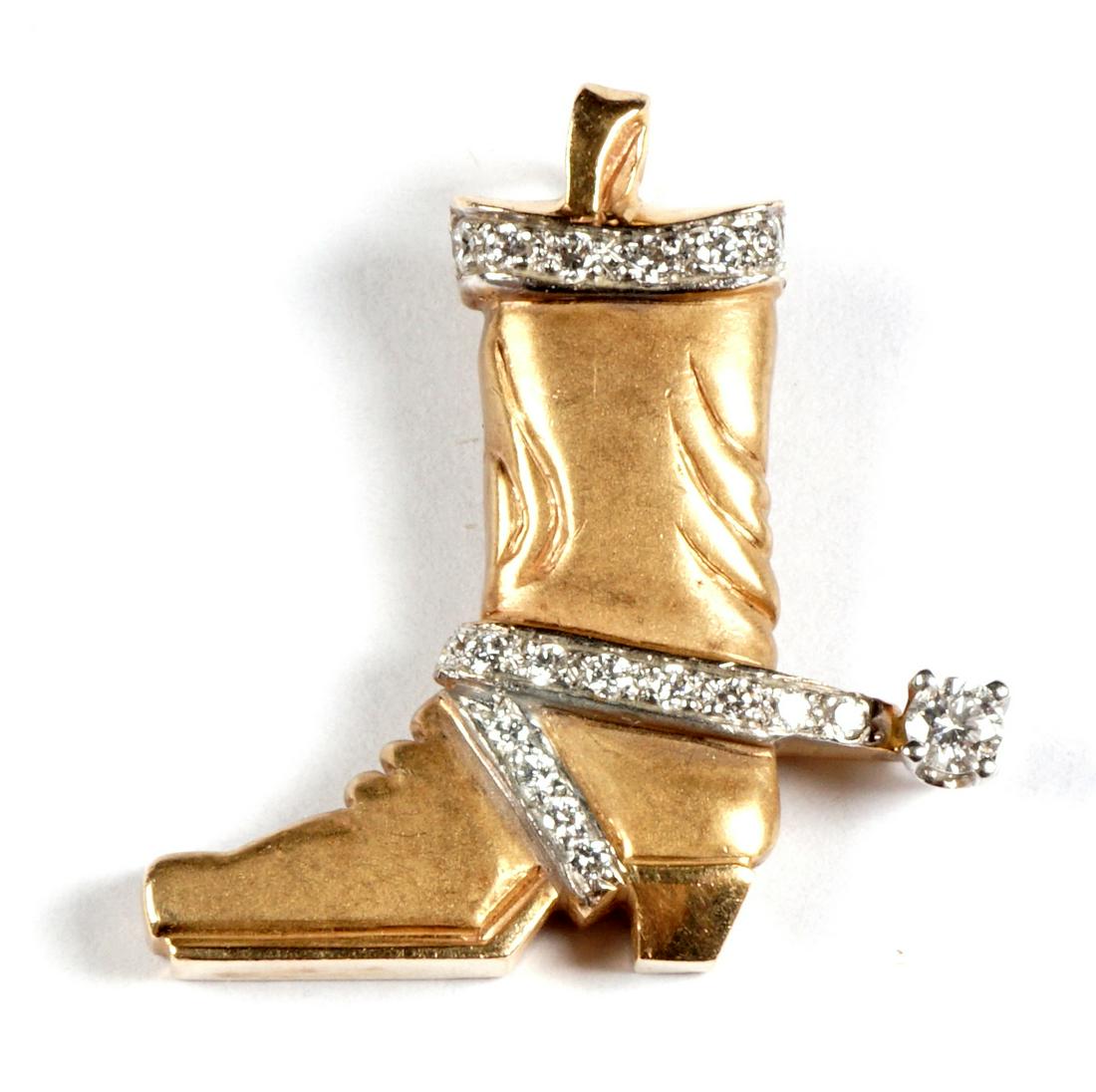 14k Yellow Gold and Diamond Cowboy Boot Pendant: Unique 14k gold cowboy boot form pendant with channel and prong set accent diamonds. stamped 14K, 1" h., approx. 5 grams.