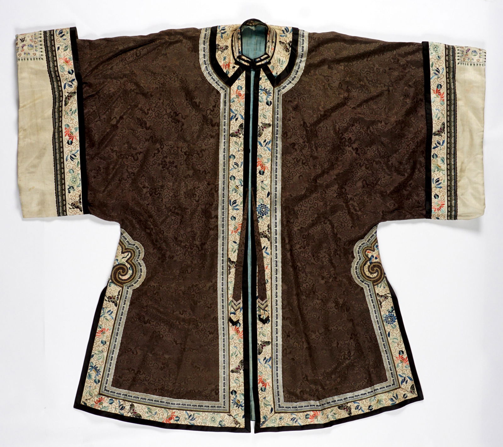 Chinese Embroidered Silk Robe: Patterned chocolate brown robe, embroidered collar, panels, and cuffs. Overall 43.5" h. Condition: Small stain to back, stitching loss at back.