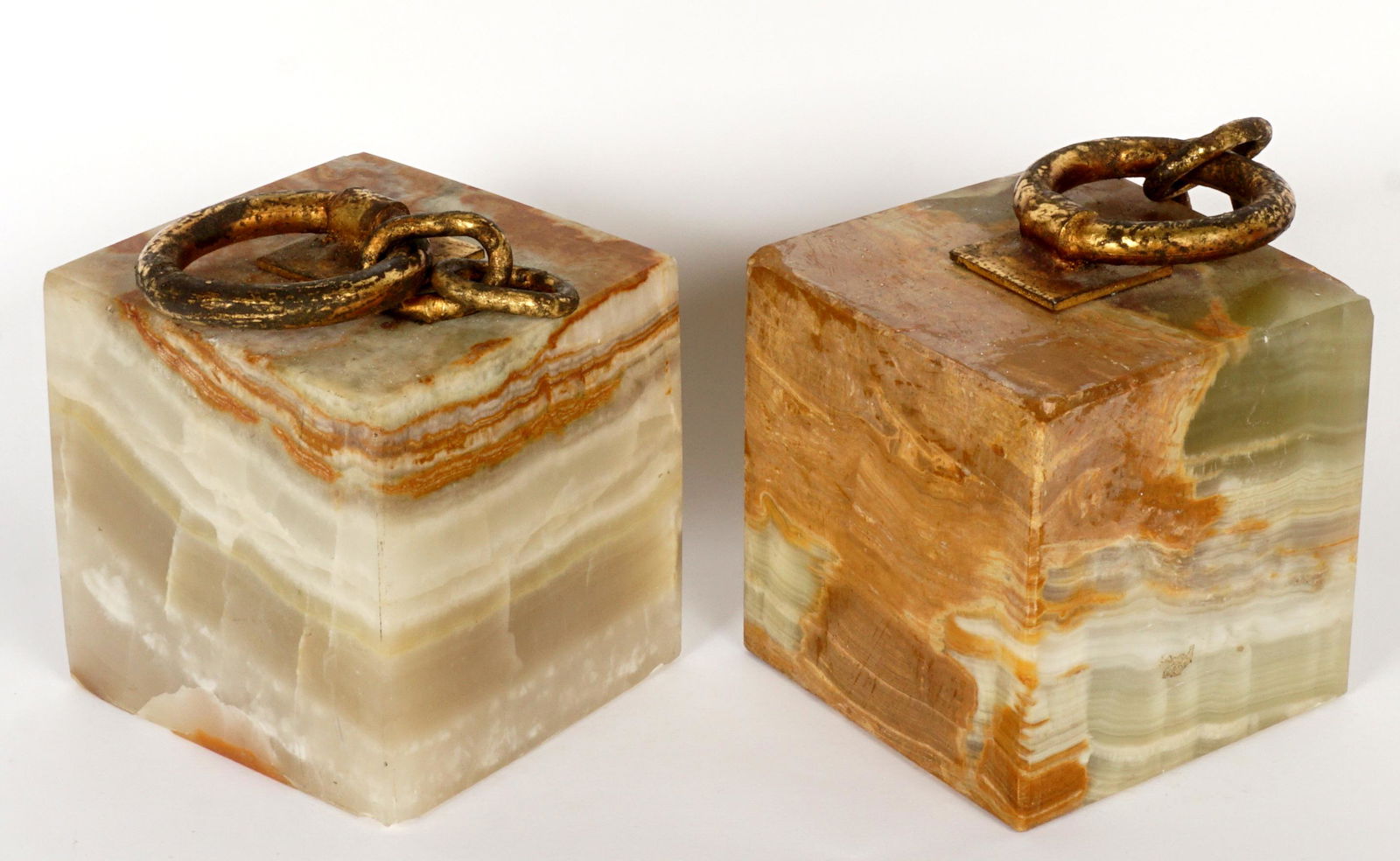 1970 Pair Curtis Jere Onyx & Gilt Steel Bookends: Gilt steel "chains" affixed to square onyx bases, each signed C. Jere, 1970. Overall 5" h. x 4" x 4". Condition: Corner and edge chips.