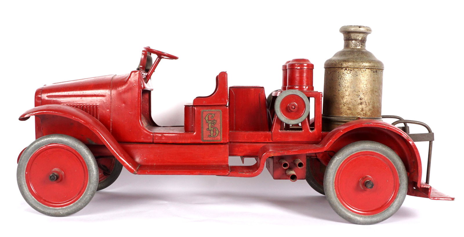 Buddy L Pressed Steel Pumper Truck: Circa 1920's red body, original decals, original steel wheels, chrome pump, overall 9.5" x 8" x 24". Condition: Minor paint touch ups, wear to decals.
