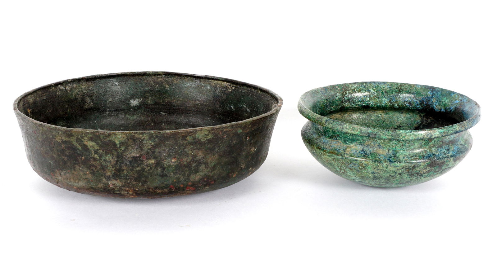Two Roman and Persian Bronze Bowls: Two pieces total to include 1) Roman, II Century, 2.5" h. x 8.25". 2) Persian, I Century, 2.25" h. x 5.5". From a private Florida collection, sold with 1979 certificates from Farid Ziade.