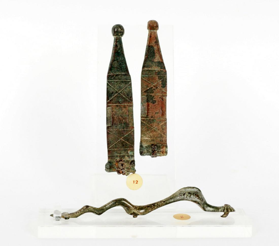 Roman 1st / 2nd C Bronze Hinges and Decoration: An assembled collection of two pieces to include 1) Pair Roman 2nd Century bronze hinges, locks, or decoration with incised design, 4.75" long. 2) shaped handle or decoration, 5.25" long. From a priva