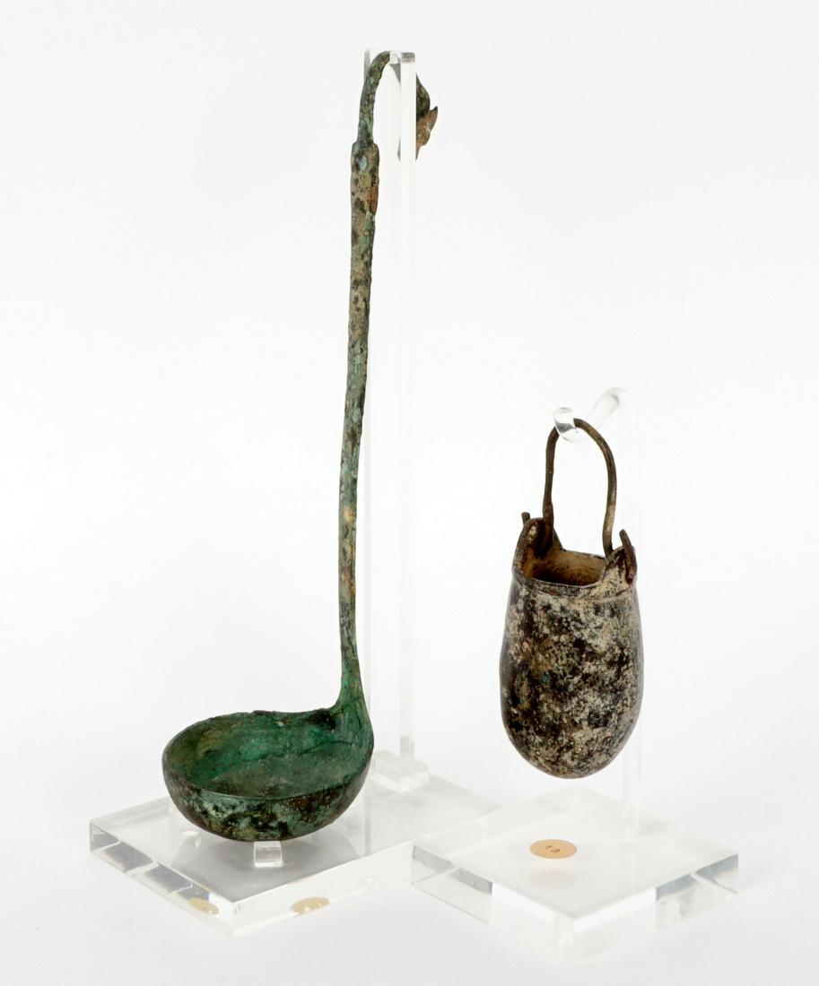 Bronze Roman Ladle & Persian Hanging Pot: An assembled collection to include 1) Hellinistique 2nd Century bronze ladle, figural head finial, 8.75" h. 2) Persian 1st Century diminutive hanging pot, 4.25" h. From a private Florida collection, s