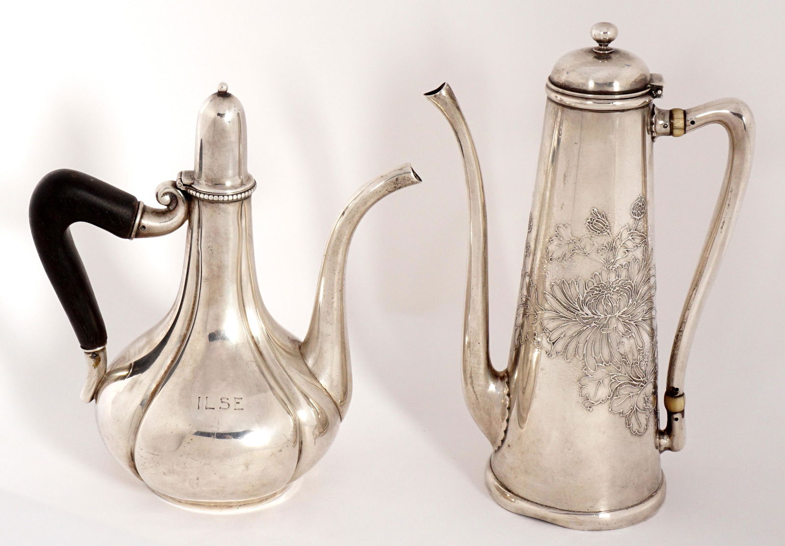 Two American Sterling Silver Demitasse Pots: Two pieces total to include 1) Whiting tapered body with raised chrysanthemum decoration, marked Whiting, Sterling 2182A. Overall 7" h. x 4.5". Ding to foot. 2) 19th Century Gorham bulbous fluted pot,
