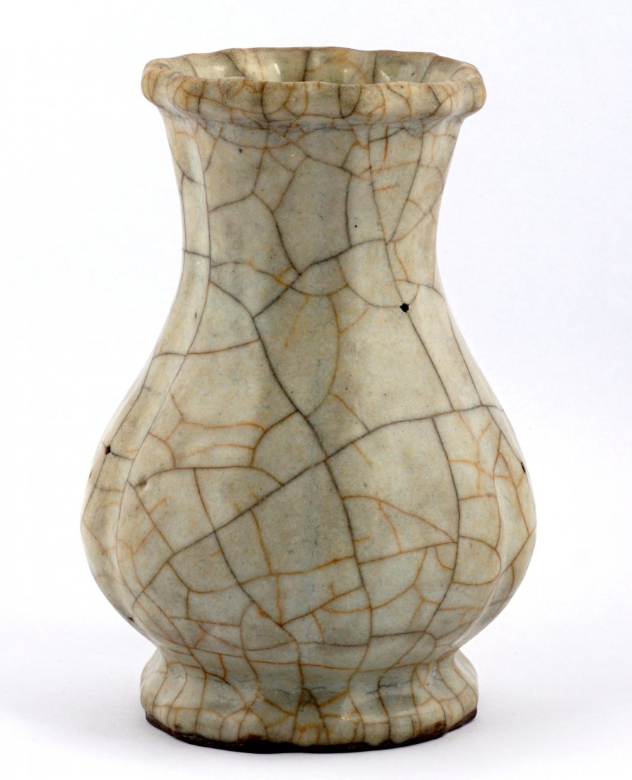 Chinese Guan Ware Lobed Crackle Glaze Vase: Possibly Song Dynasty, Guan or Kuan ware six lobed pear form vase, celadon ground with golden and dark crackle, partial older London dealers label on base, overall 5.5" h. x 4". Condition: Multiple gl