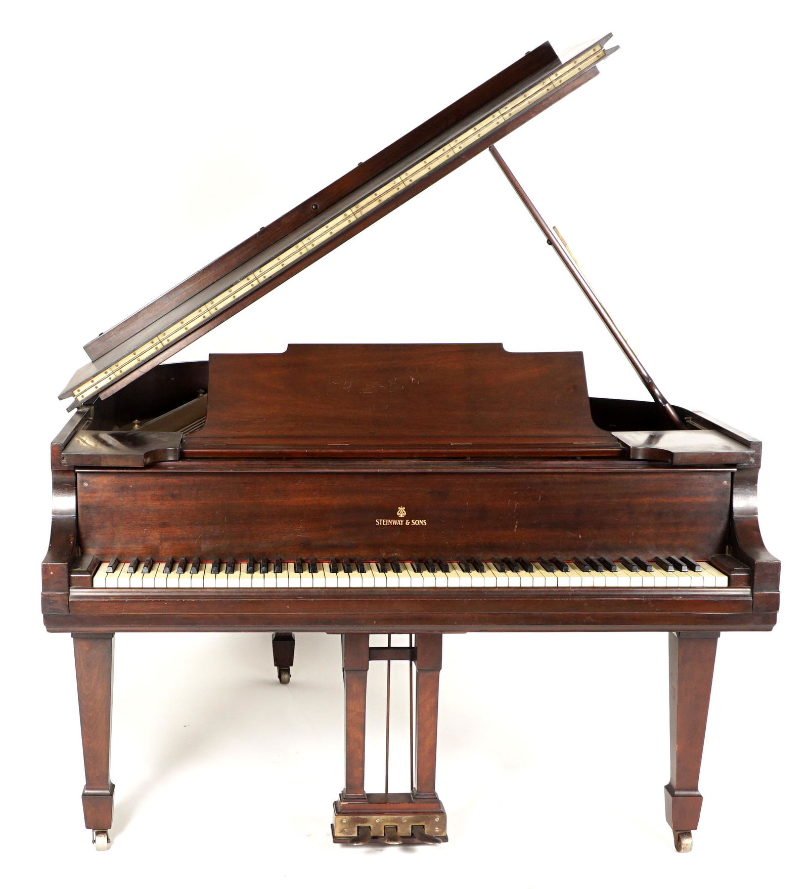 1918 Steinway Medium Grand Mahogany Piano: Circa 1918 Steinway Model M medium grand piano, mahogany case, serial number 190643, overall 38.25" h. 66" x 56.5". Condition: Uneven finish, one crack to soundboard.