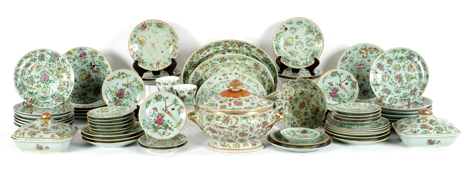 Chinese Celadon Famille Rose China Service: An assembled collection of approx. 74 pieces total to include 16 plate (10.25"), 18 plates (9.75") 6 plates (9"), 21 plates (7.75"), 5 tea cups (2.5" h. ), 1 saucer, 2 covered vegetable (9" x 8"), cov