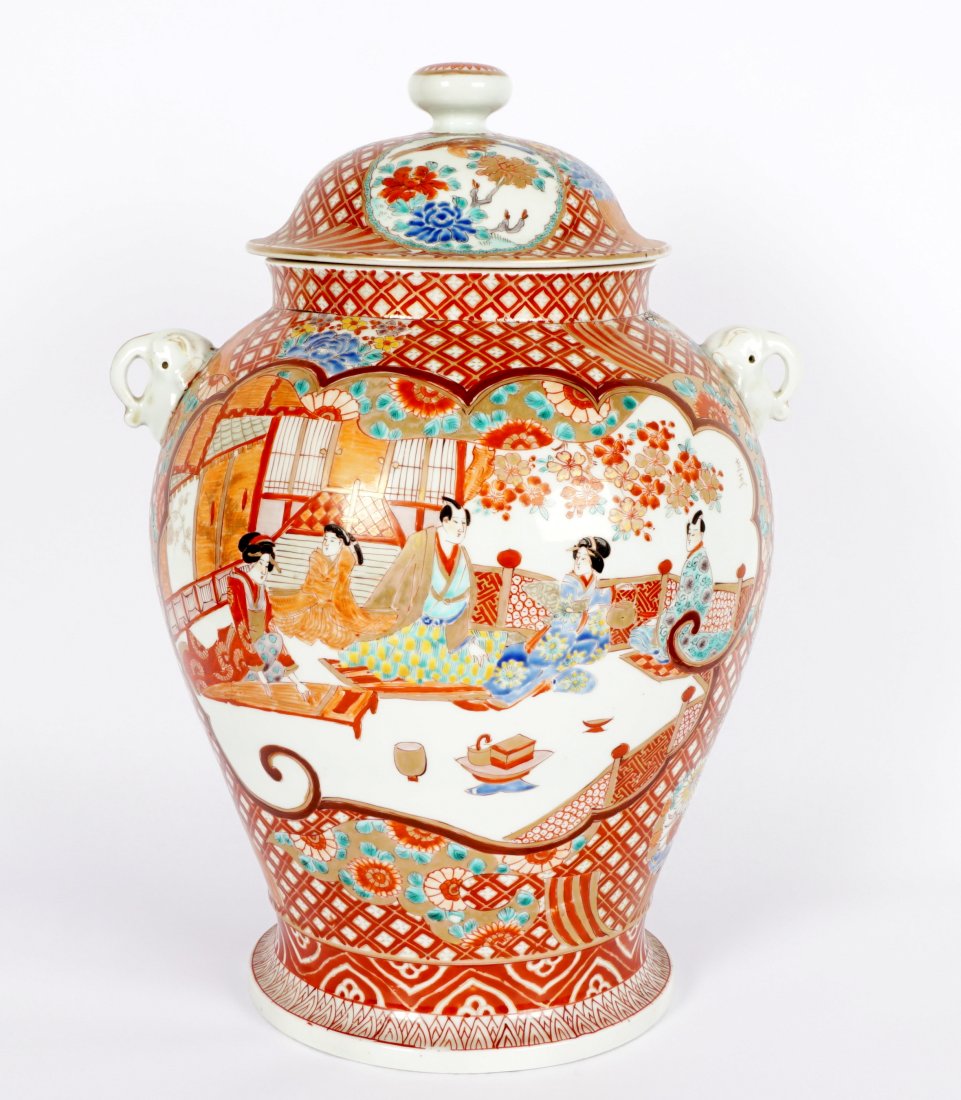 Large Japanese Imari Ginger Jar: Red ground, various genre scenes in reserves, applied elephant handles, overall with lid 18" h. x 13".