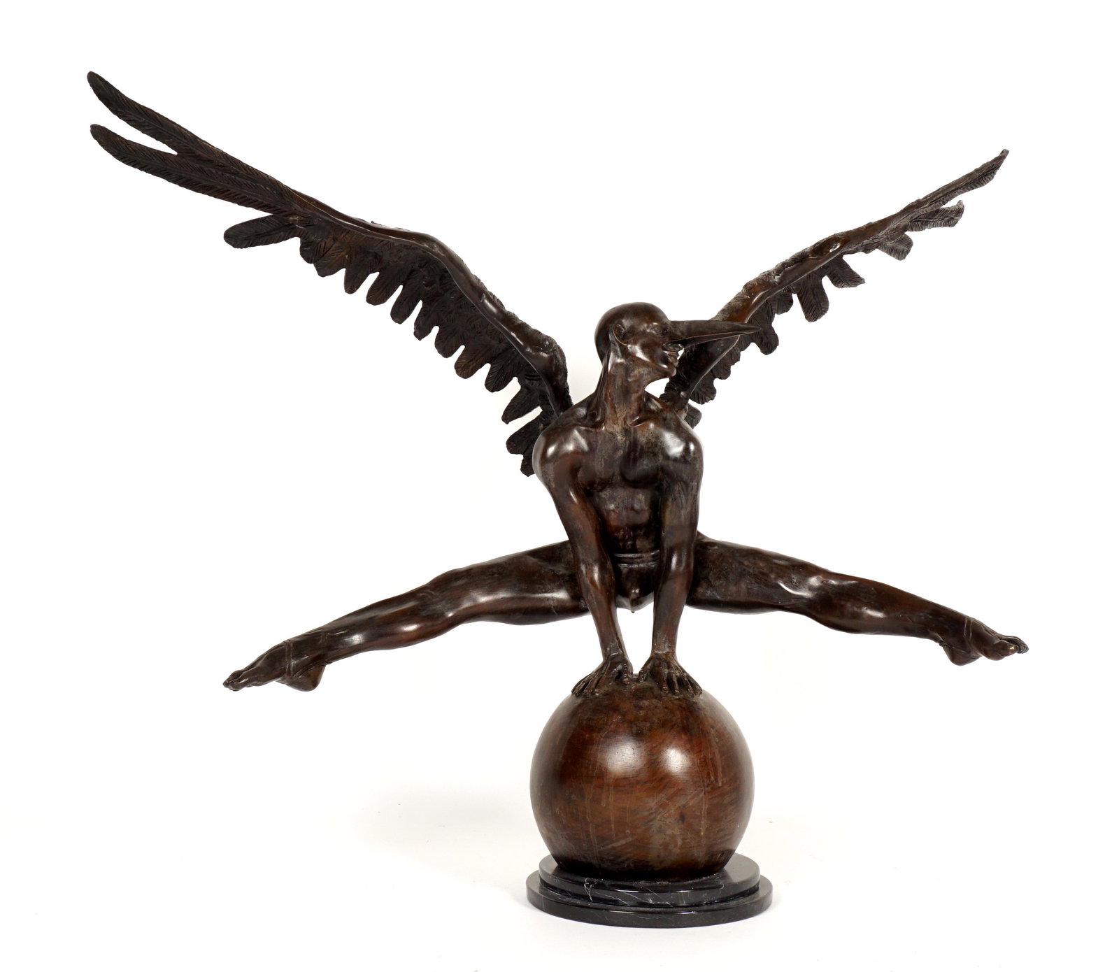 By/After Jorge Marin Large Bronze Angel on Ball: by/after MARIN, Jorge, (Mexican, 1963-): Figure of a winged angel in gymnastic pose with outstretched legs and wings, signed, on marble plinth, 35" x 46.25".