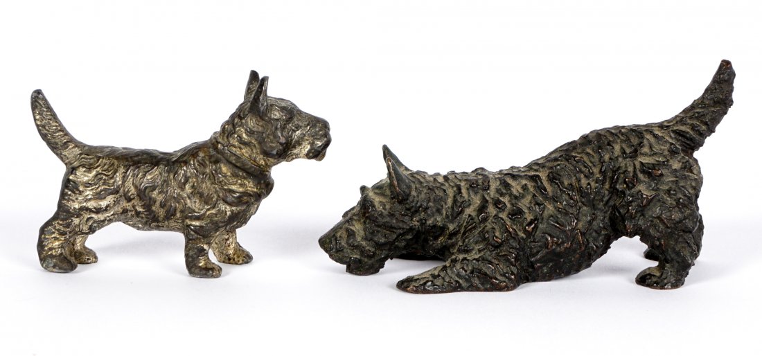 Two Bronze Scotty Dogs Including Kirmse: Two figures of Scottish Terriers to include 1) KIRMSE, Marguerite, (American, 1885-1954), figure or a crouching Scotty, impressed M. Kirmse, OGOL, 2" h. x 3.5". 2) Unsigned standing Scotty, 1.75" h. x