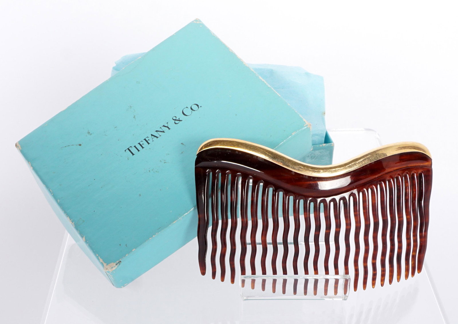 Tiffany & Co. 14k & Faux Tortoise Shell Hair Comb: 14k yellow gold band, composite faux tortoise shell teeth, overall 2" x 3.5". Sold with a Tiffany box.