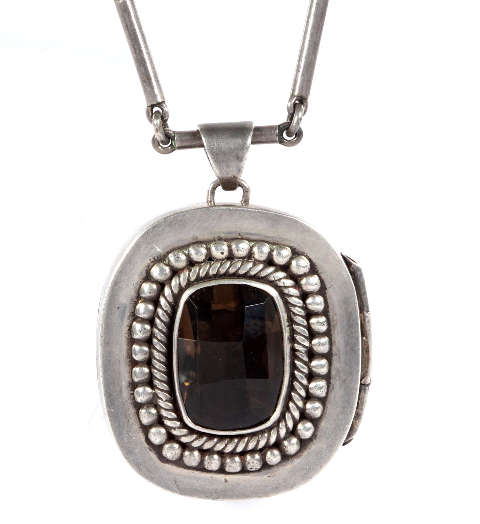 Antonio Pineda Silver and Smoky Quartz Necklace: Mexican silver locket and necklace from Antonio Pineda, well marked inside locket with smoky quartz cabochon, 1.75" x 1.5", link necklace 19" long.
