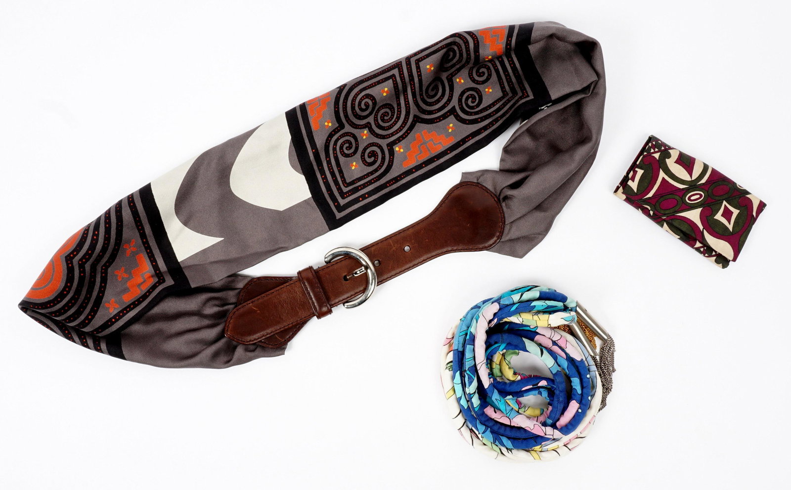 Three Bessi and Etro Belts and Pucci Key Wallet: Four pieces total to include 1-2) Two Averardo Bessi floral motif corded belts, one with gold toned ends, the silvered, 72" long. 3) Etro silk and leather scarf belt, 42" long. 4) Pucci paisley cloth