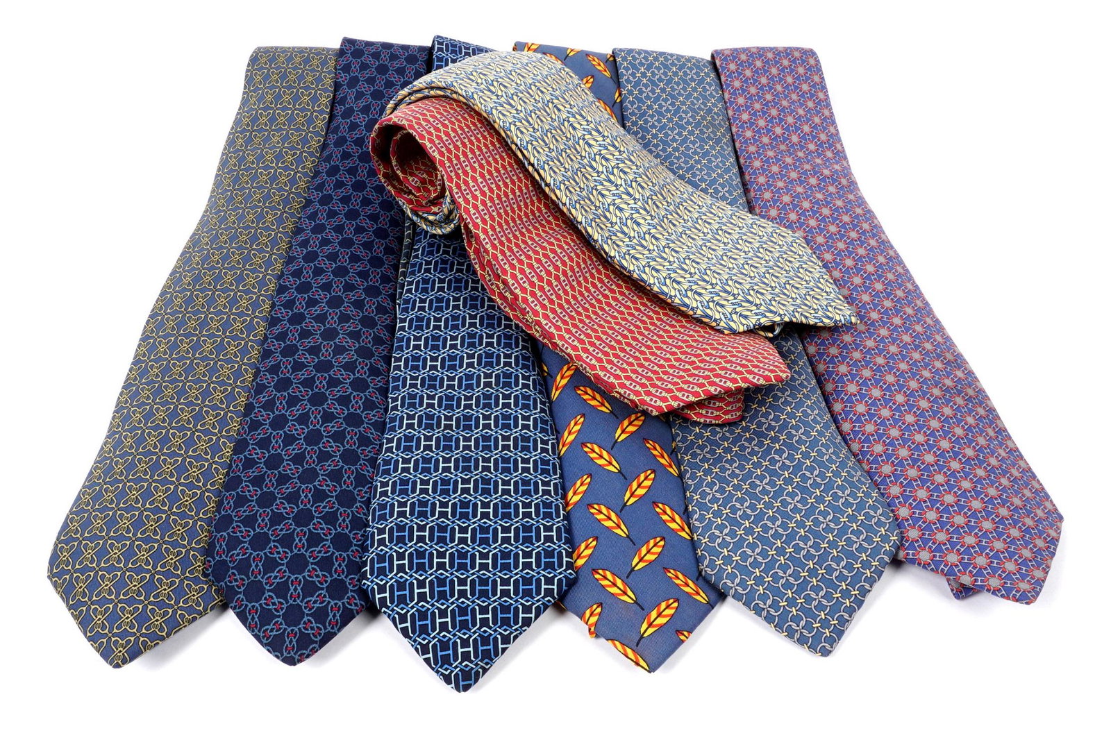 Eight Hermes Silk Neck Ties: Assorted patterns, each well marked with Hermes labels, some with soiling otherwise overall very good condition.