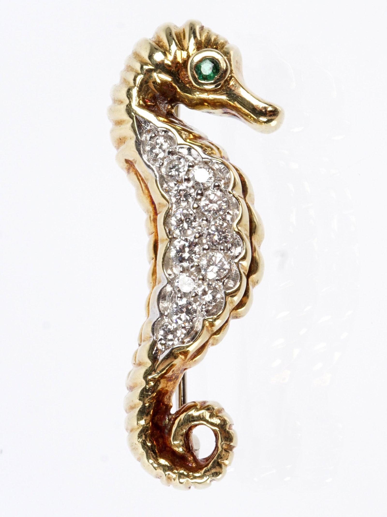 14k Yellow Gold and Diamond Seahorse Brooch: Figural seahorse 14k gold pinback brooch, approx. .4ctw diamond accents, emerald eye, 1.5" long, approx 5.1 grams