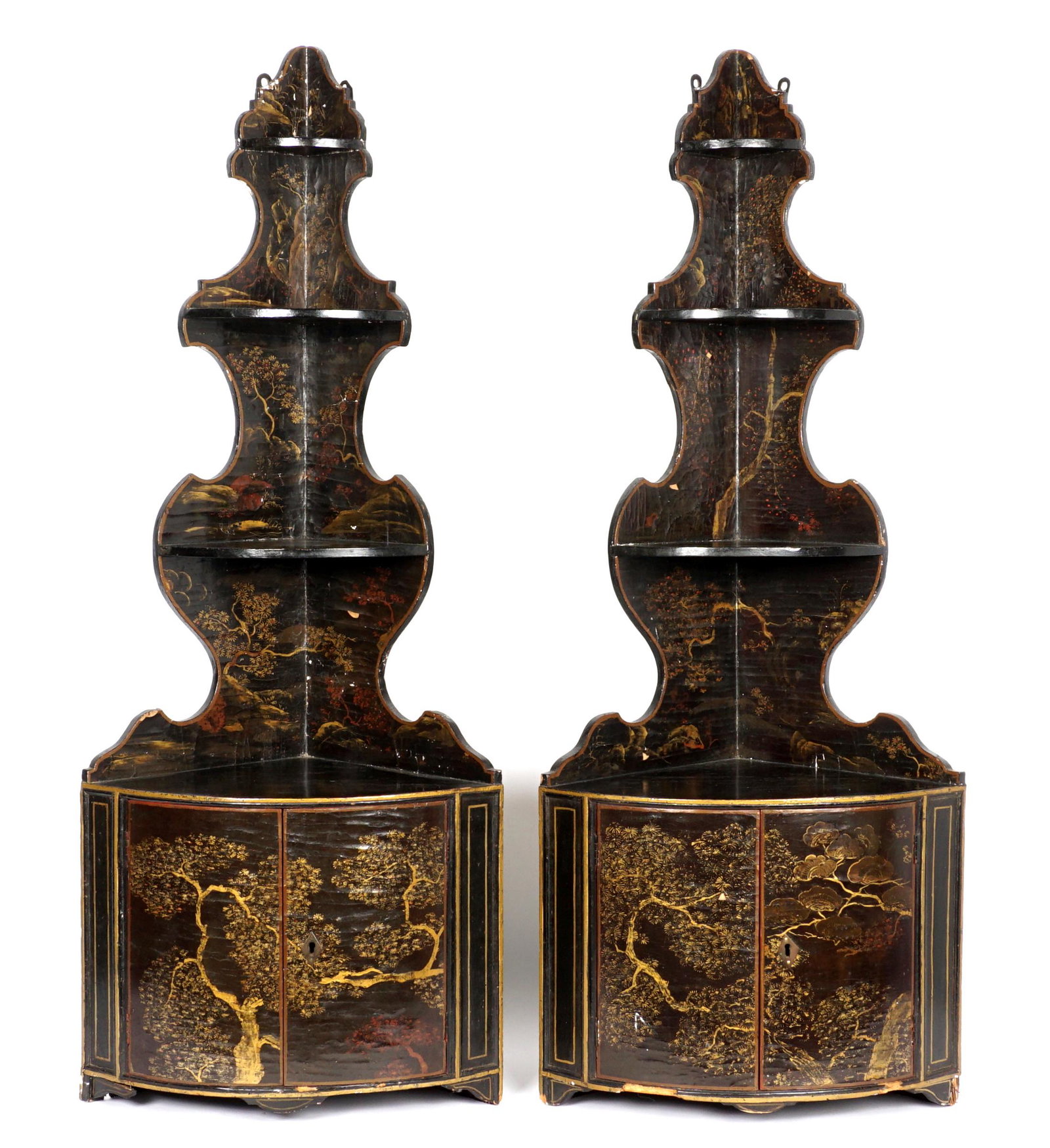 Pair 19th C. Chinoiserie Hanging Etagere Cabinets: Black lacquer Chinese chinoiserie decorated hanging cabinet, three graduated shelves over two doors, overall 46" h. x 18" x 12.5". Condition: Chips and craquelure to lacquer.