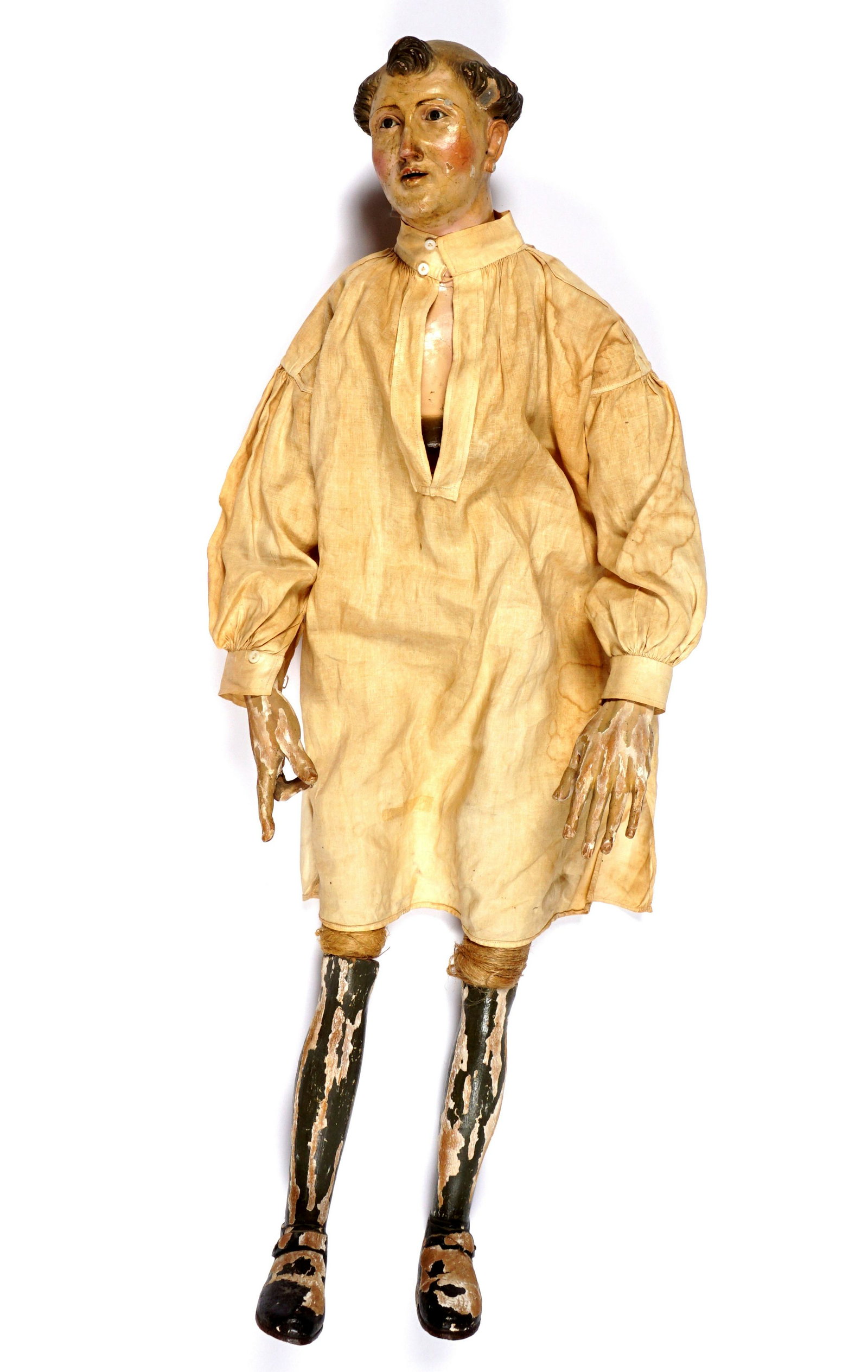 Large Neapolitan Creche Figure: Carved and painted tall figure of a man in a nightshirt, wrapped wire body, carved limbs, overall 31.5" h. x 12" x 7.5". Condition: Paint loss, repairs.