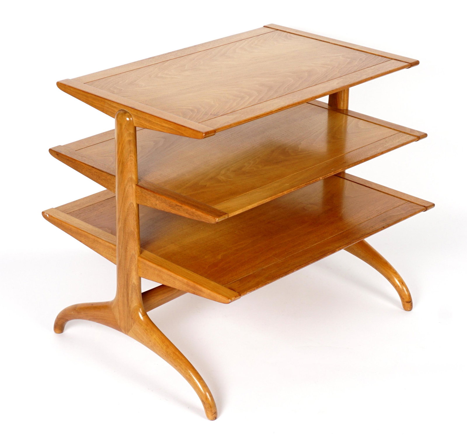 Henredon Heritage Magazine Tree / Table: Three tier magazine tree in the manner of Edward Wormley, on curved feet, marked Heritage under lowest shelf, overall 25.25" h. x 28.5" x 24".