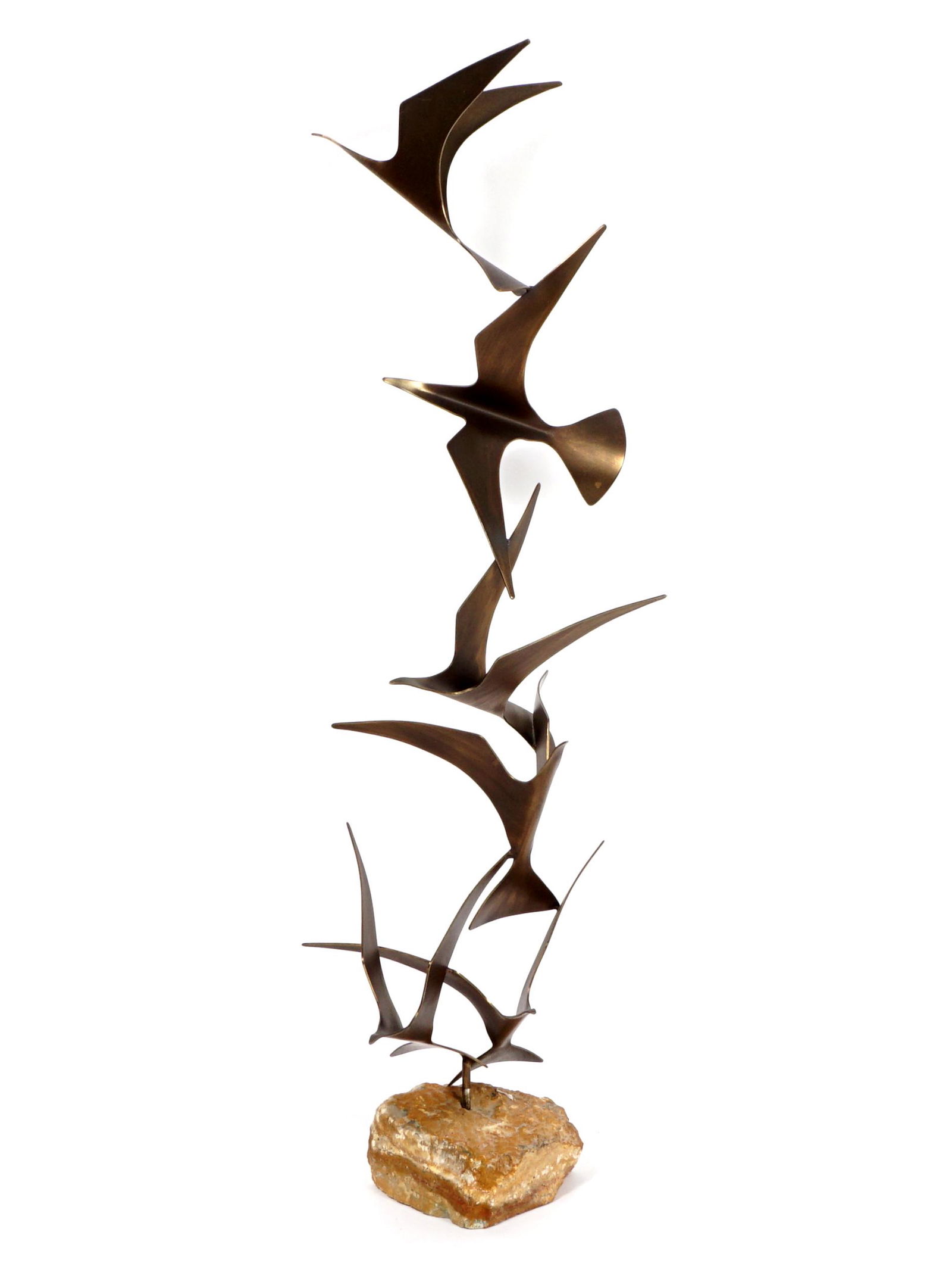 1981 Curtis Jere Birds in Flight Sculpture: Stack of six patinated brass seagulls in flight, affixed to rock base, signed C. Jere and dated 1981. Overall 49.5" h. x approx. 16.5" dia.