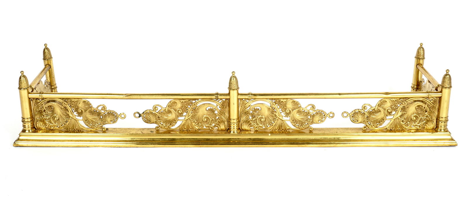 Attrib. Henry Hobson Richardson Fireplace Fender: Attributed to famed architect Henry Hobson Richardson, weighted embossed brass foliate scroll design, five rising turrets, no visible markings. Overall 9.75" h. x 54" x 14". Condition: Dents, dings, a