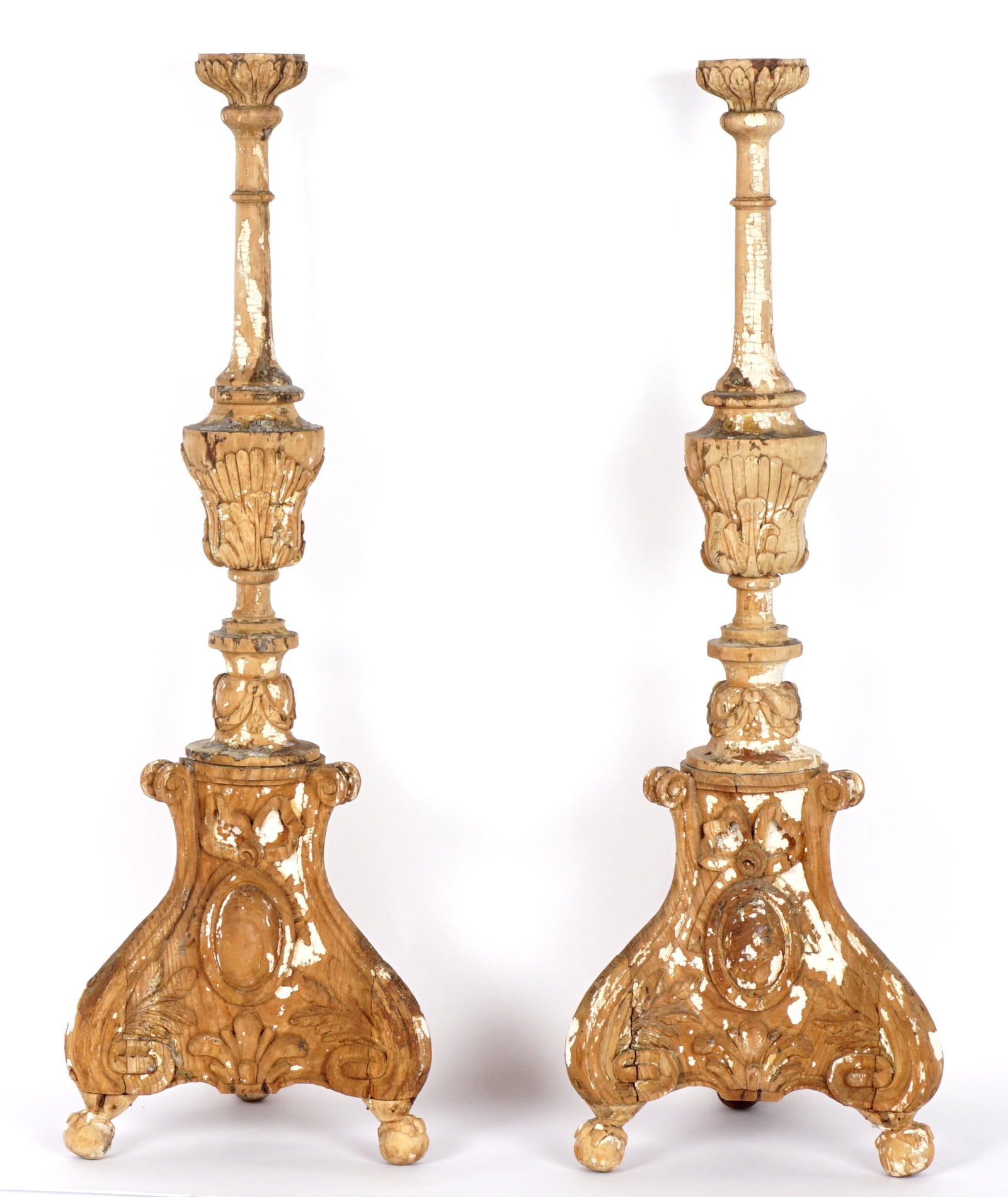 Pair Early 19th C Italian Carved Pricket Sticks: Rococo style carved pricket candlesticks, early 19th Century, traces of white gesso remaining, overall 32" h. x 10.75". Condition: Age splits and separations.
