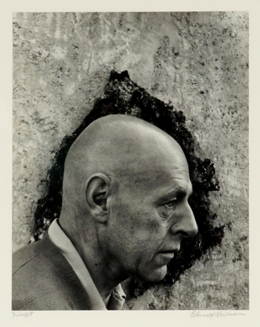 1956 Arnold Newman Jean Dubuffet Photograph: NEWMAN, Arnold, (American, 1918-2006): Silver gelatin print of artist Jean Dubuffet in profile, circa 1956, pencil signed under photograph on right, title Dubuffet left, Arnold Newman copyright sticke