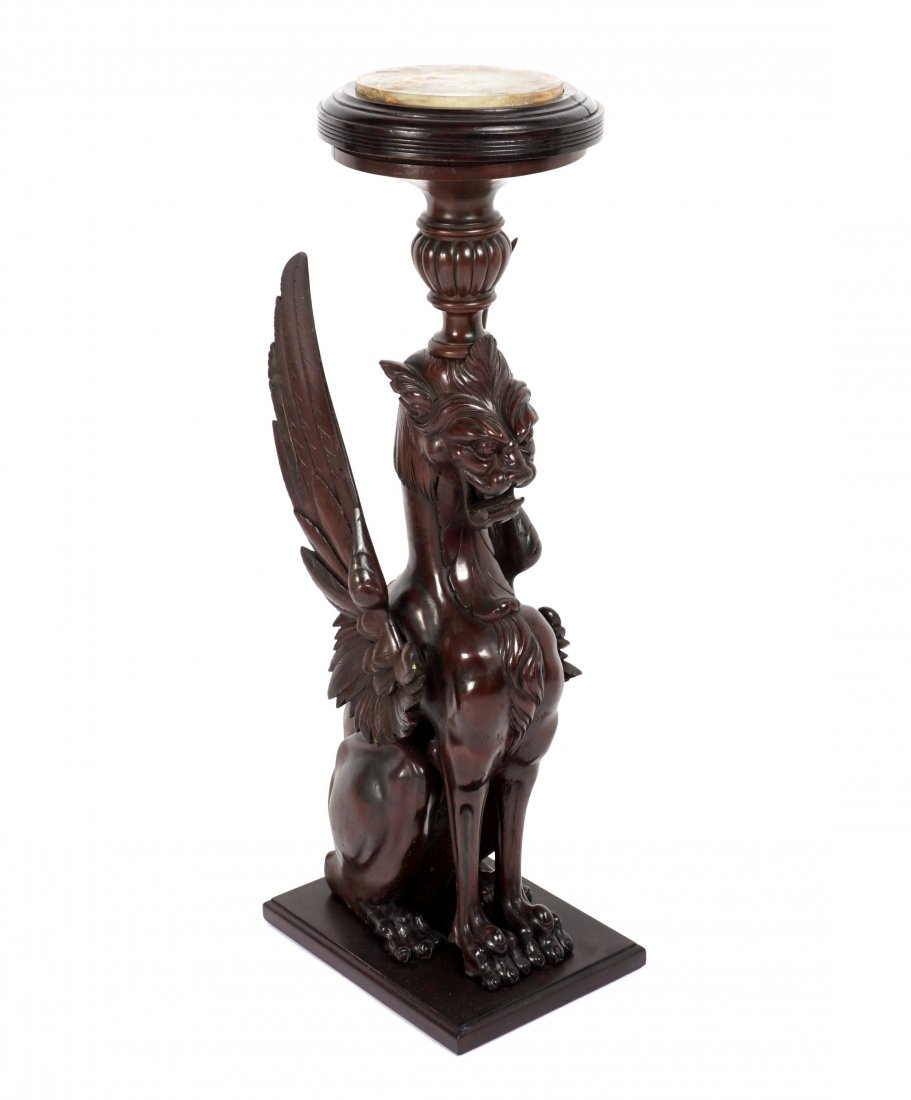 Attrib. RJ Horner Winged Griffin Plant Stand: Manner of RJ Horner, mahogany plant stand / pedestal in the form of a seated winged griffin, round onyx top, overall 44.5" h. x 13" x 20".