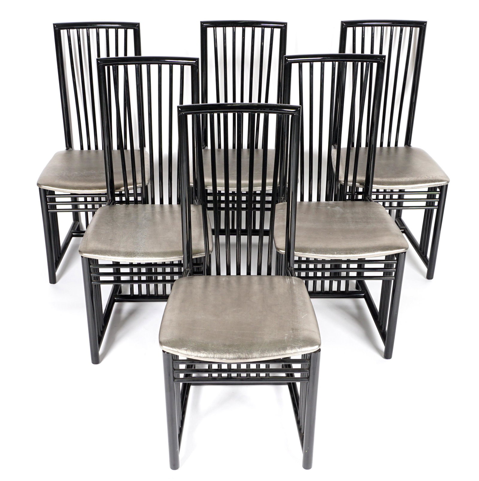 Six Sibau Italian Designer Dining Chairs: Set of six side chairs by A. Sibau, turned wood black lacquer frames, silver vinyl cushions, 38.25" h. x 17.5" x 20". Condition: Minor signs of use and wear.