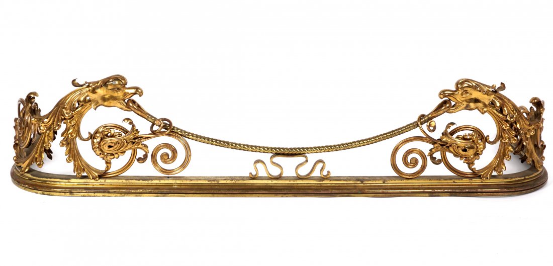 Attrib. Herter Brothers Brass Fireplace Fender: Attributed to Herter Brothers, brass and bronze foliate scroll and eagle heads, unmarked, overall 13.5" h. x 61" x 19". Condition: Spotting to brass and finish.